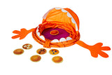 Game set up to play.  Pancake monster lies flat on the floor with its mouth open ready to eat.  Various pancake cards are lying around it.