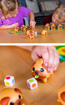 Two kids playing the game and a closeup shot of a child squeezing the pug to show the colorful tongue matching one of their dice.