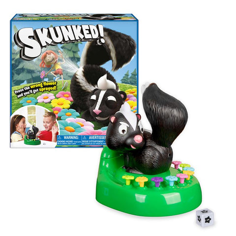 Game box and game set up outside of box.  Green base with colorful flower buttons placed around a sculpted skunk figure.  