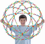 Child holding a hoberman sphere fully expanded.