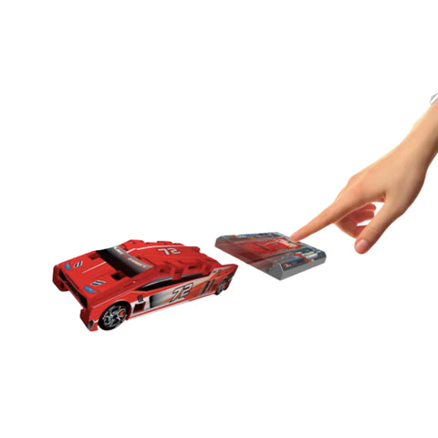 kid pressing button launching a red race car