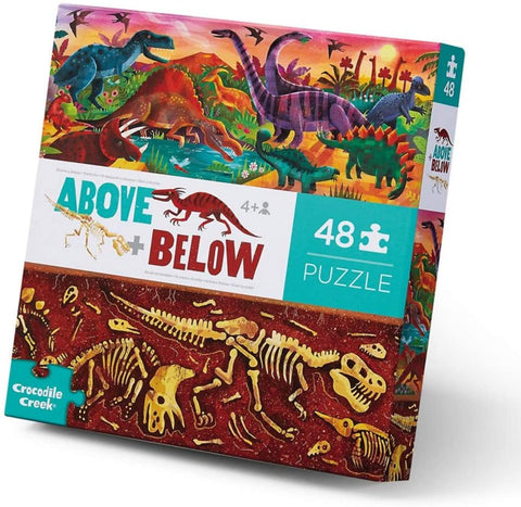 Packaging reads Above + Below.  48 piece puzzle.  Imagery shows at the top of the box living dinosaurs in a setting around a watering hole.  The bottom half of the box depicts dinosaur fossil skeletons underground.