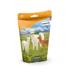 Packaging is a carboard pouch with orange highlights and the Schleich and Wild Life logos.  Main image on the package are the 3 alpacas  and the adult has the leaf in its mouth.
