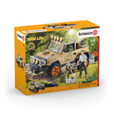 Item packaging in orange colored box.  Schleich logo prominent along with the Wild Life theme logo.  Product photography shows the vehicle and accessories included in a jungle setting.  